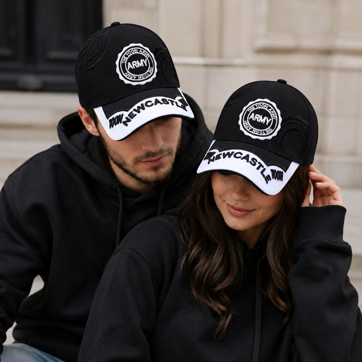 Black Newcastle supporter baseball cap with white contrast peak and raised NEWCASTLE lettering, product view 1