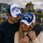 Couple wearing Scotland flag embroidered baseball caps in blue and white colourways