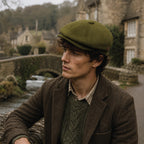 Navy blue newsboy cap styled with tailored blazer and dress pants